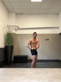 a man posing in a gym